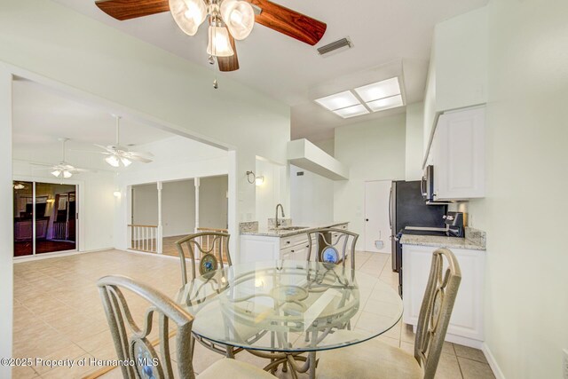 dining area featuring visible vents, baseboards, and light tile patterned floors