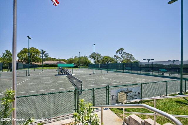 view of sport court with fence