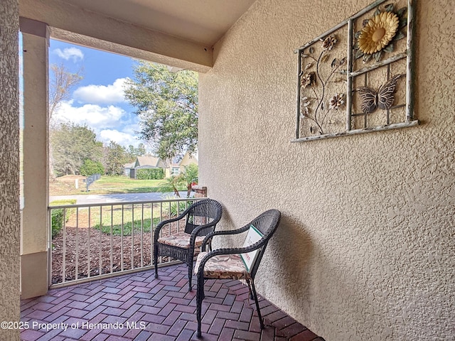 view of patio / terrace featuring a balcony