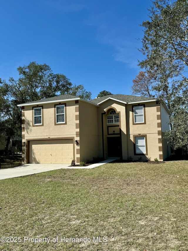 view of front of home featuring a front lawn, concrete driveway, an attached garage, and stucco siding