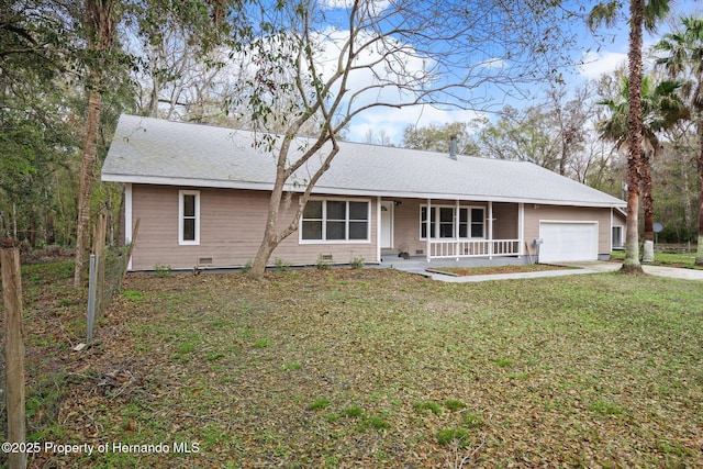 ranch-style home with a garage, covered porch, a front lawn, and concrete driveway