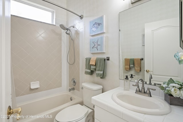 full bathroom featuring vanity, shower / tub combination, and toilet