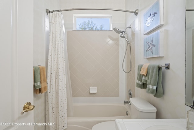 full bathroom featuring vanity, shower / tub combo, and toilet