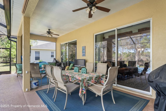 sunroom with a ceiling fan