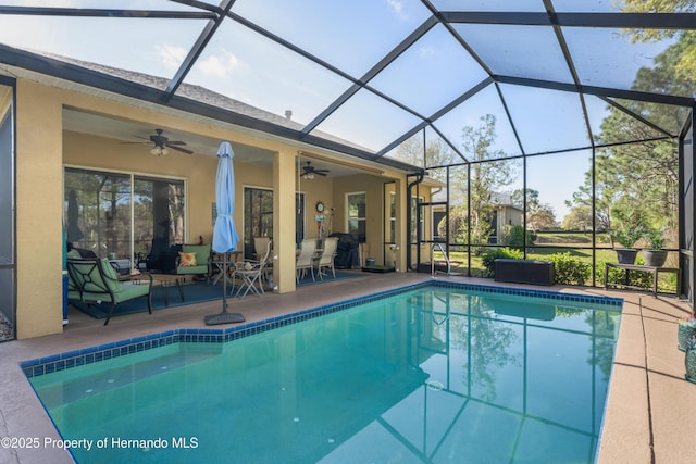 pool with a lanai, a ceiling fan, and a patio