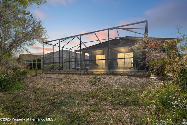 rear view of property with glass enclosure