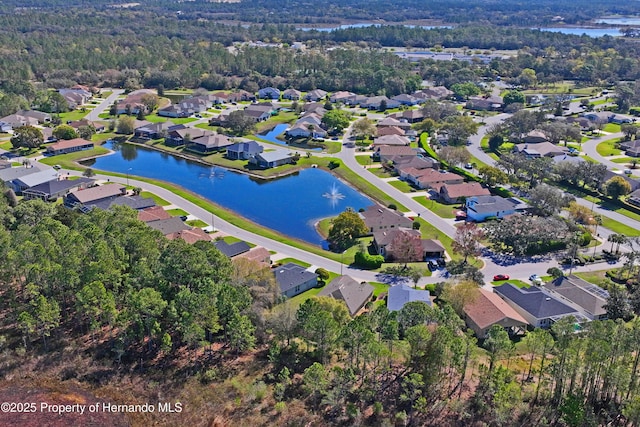 drone / aerial view with a residential view and a water view