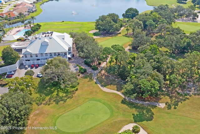 bird's eye view featuring a water view and view of golf course