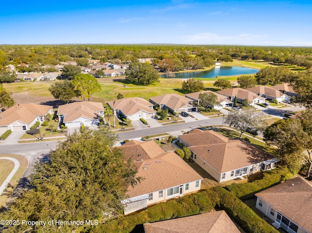 drone / aerial view with a water view and a residential view