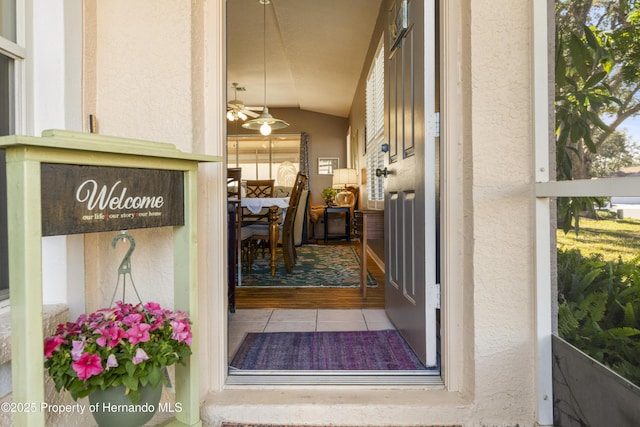 view of exterior entry with stucco siding