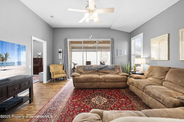 living room featuring lofted ceiling, ceiling fan, and wood finished floors