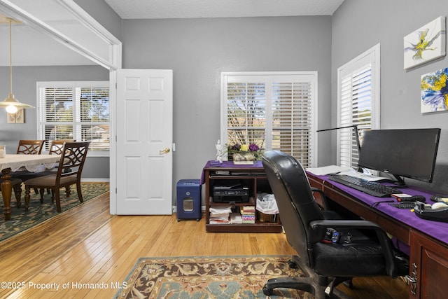 office space with light wood finished floors