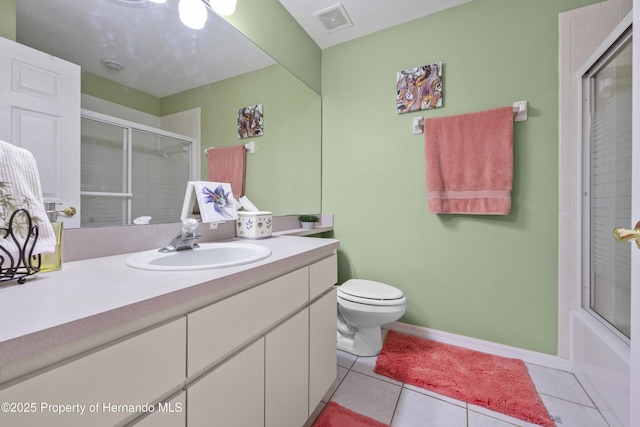 full bathroom featuring visible vents, toilet, combined bath / shower with glass door, vanity, and tile patterned floors