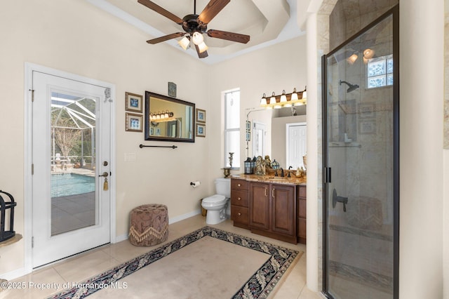full bathroom with a shower stall, tile patterned flooring, vanity, and a ceiling fan
