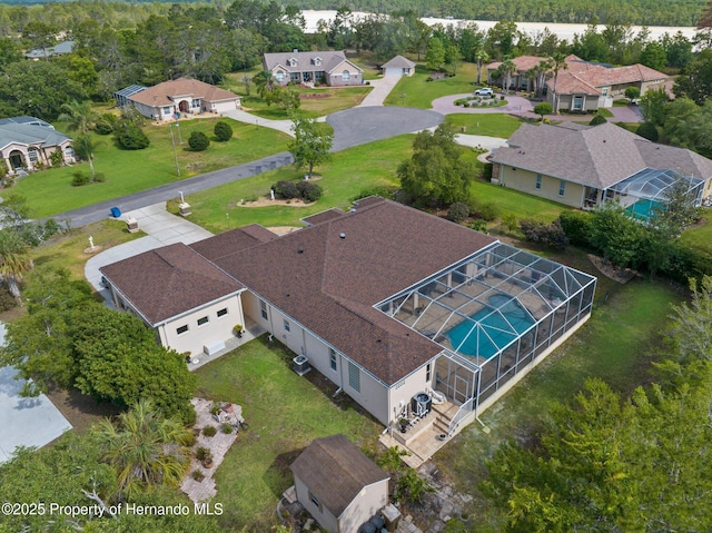 birds eye view of property with a residential view