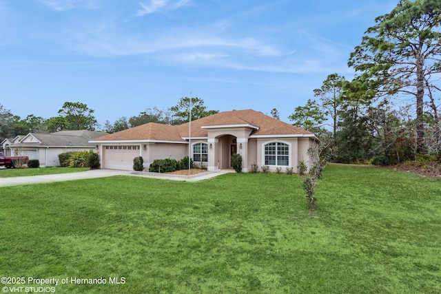 mediterranean / spanish-style house with a garage, a shingled roof, concrete driveway, a front lawn, and stucco siding