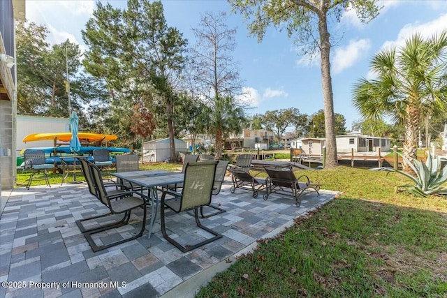 view of patio featuring outdoor dining area