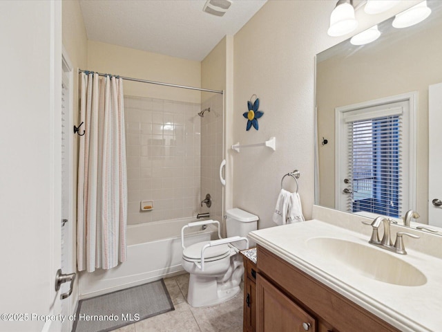 bathroom featuring shower / bath combination with curtain, vanity, toilet, and tile patterned floors