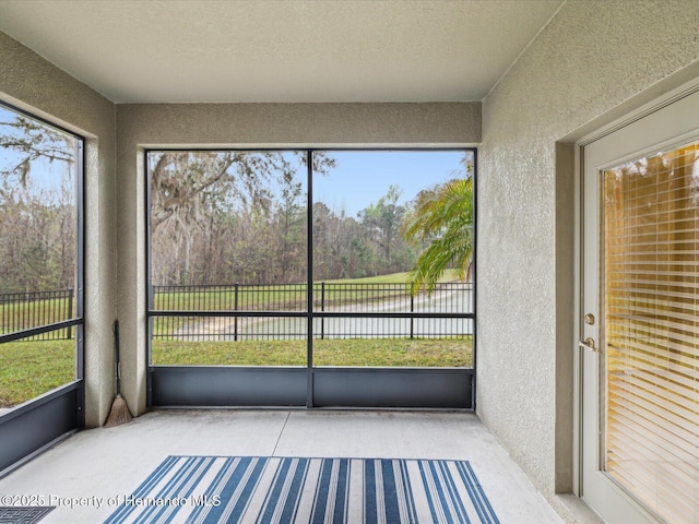 unfurnished sunroom with a healthy amount of sunlight