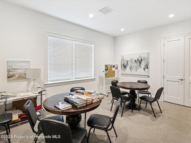 dining space with recessed lighting, visible vents, and light carpet