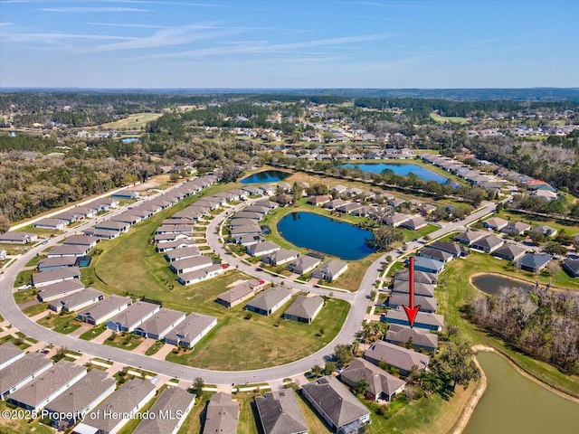 birds eye view of property featuring a residential view and a water view