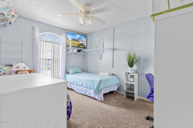 bedroom featuring a textured ceiling, ceiling fan, and carpet flooring