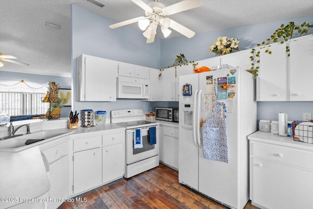 kitchen with light countertops, white cabinets, a sink, a textured ceiling, and white appliances