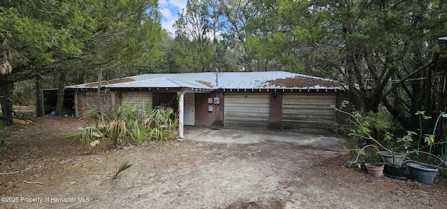 single story home with metal roof