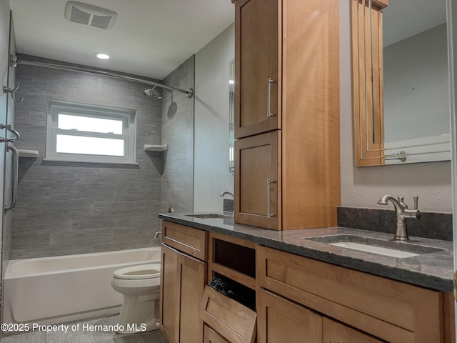 full bath with toilet, visible vents, shower / washtub combination, and vanity