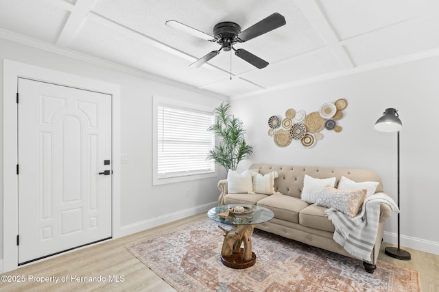 living room featuring light wood finished floors, coffered ceiling, and baseboards