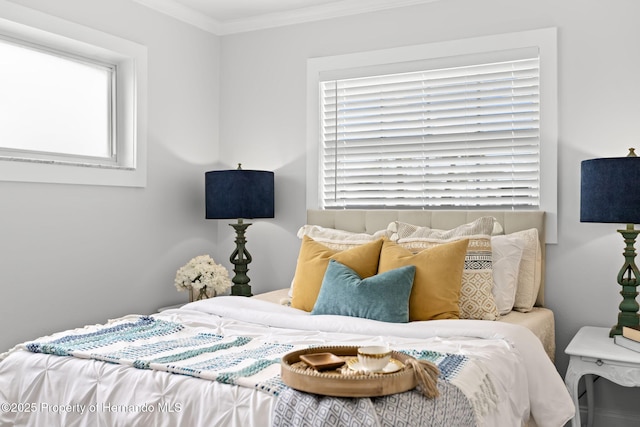 bedroom with ornamental molding