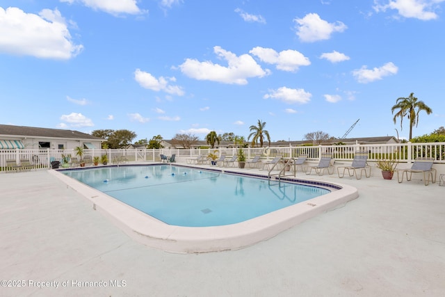 pool with fence and a patio