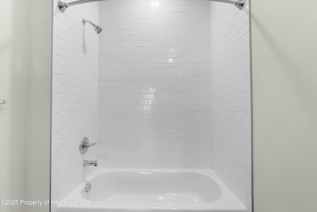 bathroom with shower / tub combination