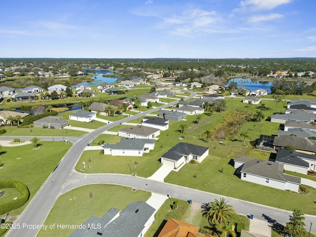 bird's eye view featuring a residential view and a water view