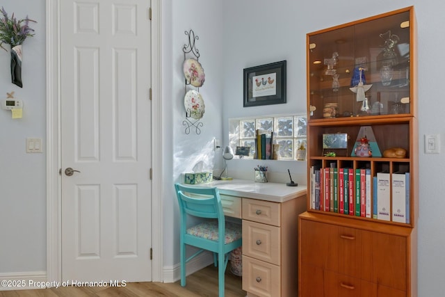 home office featuring wood finished floors