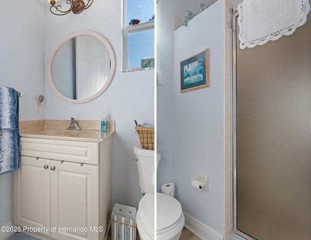 full bath with a stall shower, vanity, and toilet