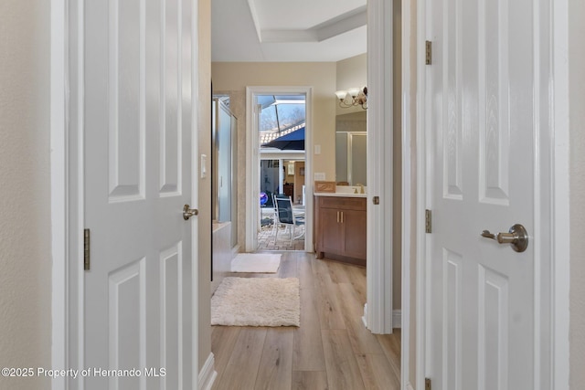 hallway featuring light wood-style floors