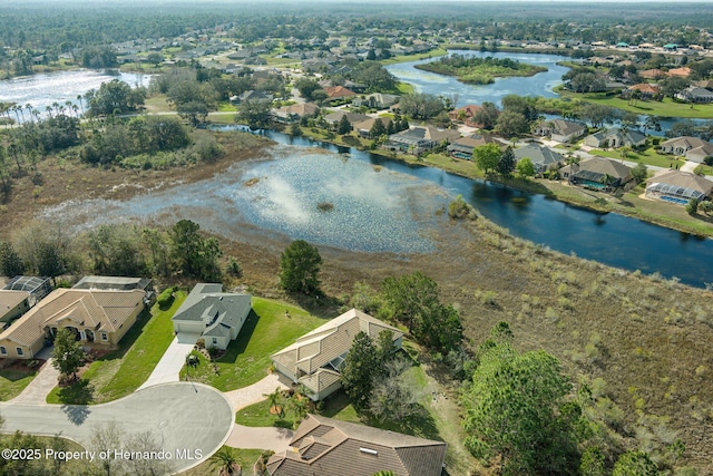 bird's eye view featuring a residential view and a water view