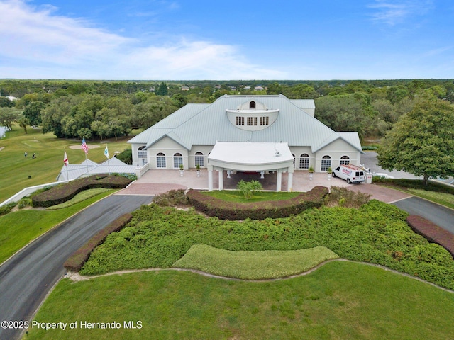 birds eye view of property with a forest view