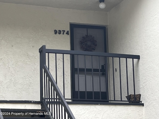 property entrance featuring stucco siding