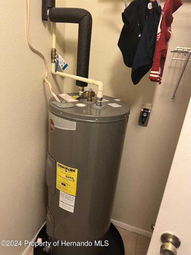 utility room with water heater