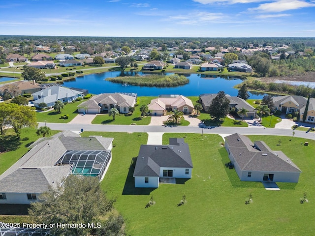 bird's eye view with a water view and a residential view