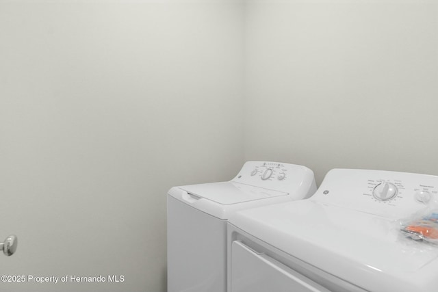 clothes washing area featuring laundry area and independent washer and dryer