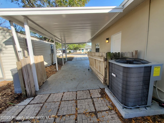 view of patio featuring fence and central AC unit