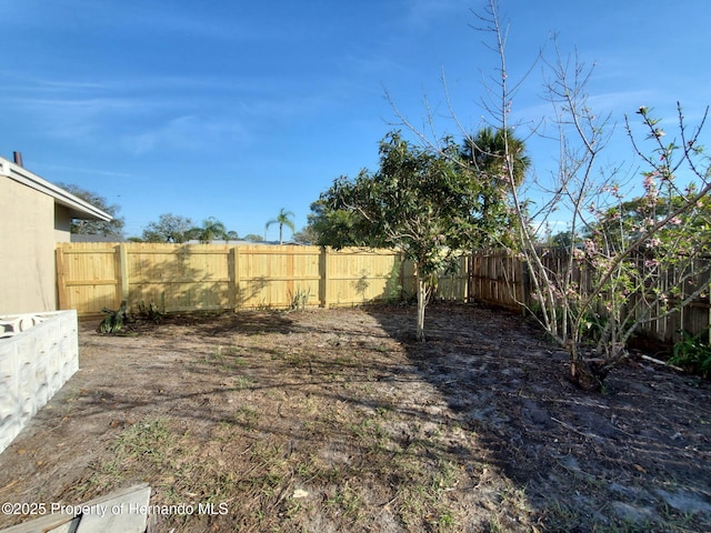 view of yard with a fenced backyard