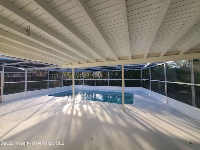 view of pool with a patio, a lanai, a fenced in pool, and fence