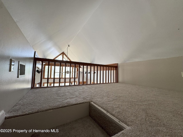 bonus room featuring carpet floors and vaulted ceiling