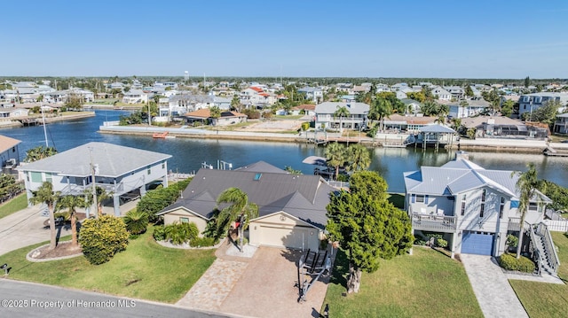 bird's eye view with a residential view and a water view