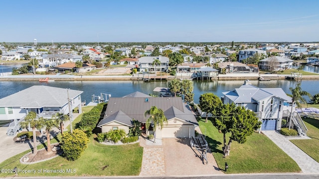 bird's eye view with a water view and a residential view