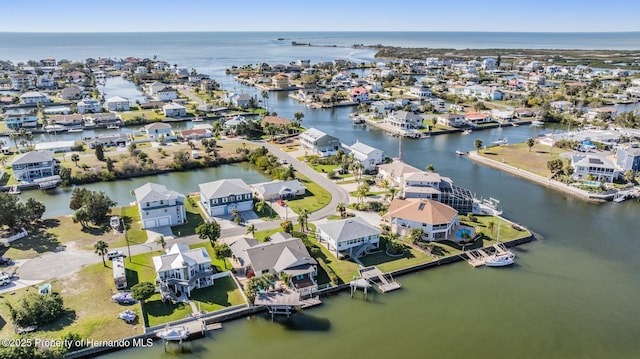 birds eye view of property featuring a residential view and a water view